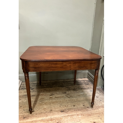 510 - A 19th century mahogany tea table, rectangular having a fold over top with boxwood inlay to the apro... 