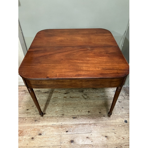 510 - A 19th century mahogany tea table, rectangular having a fold over top with boxwood inlay to the apro... 