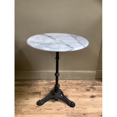 519 - A Victorian style cast iron and marble garden table