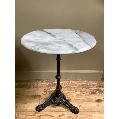 519 - A Victorian style cast iron and marble garden table