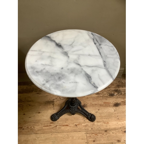 519 - A Victorian style cast iron and marble garden table