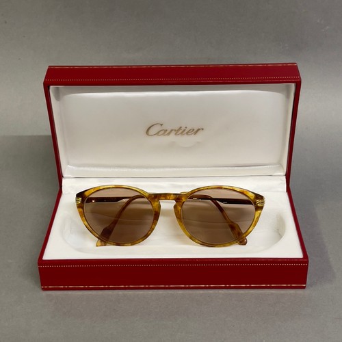 75 - A pair of Aurore Cartier prescription sunglasses with marbled frames signed Cartier, I.D card in ori... 