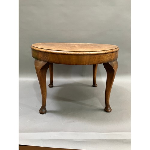 511 - A walnut quarter veneered occasional table on cabriole legs with pad feet, 60cm