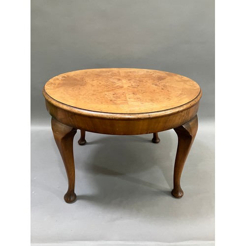 511 - A walnut quarter veneered occasional table on cabriole legs with pad feet, 60cm