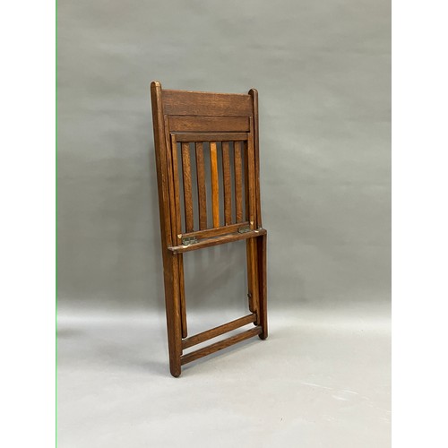 523 - A 1930/40s oak folding chair with slatted seat