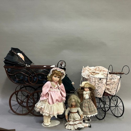 185 - A collection of porcelain dolls with three Victorian style prams