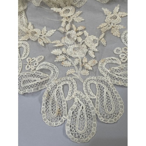 277 - Antique Lace: a fine triangular shawl in Honiton bobbin lace appliqué, the corners featuring large f... 