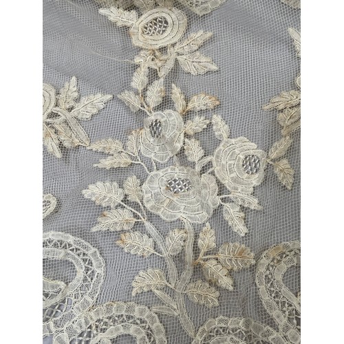 277 - Antique Lace: a fine triangular shawl in Honiton bobbin lace appliqué, the corners featuring large f... 