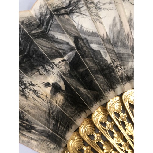 32 - Two mid-19th century fans, the first with carved and pierced wood sticks, painted in gold, the cream... 