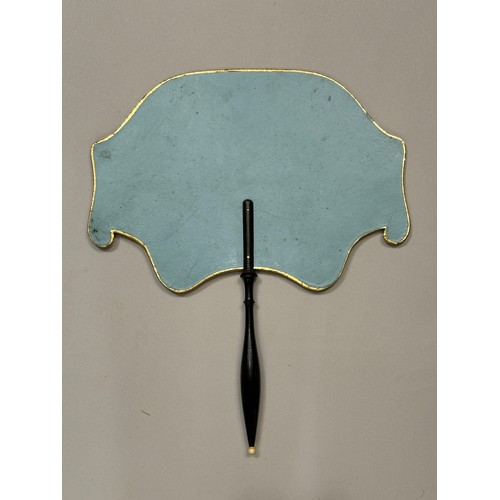 18 - A good regency fixed fan, shaped, the recto applied with gold foil and a gravure showing a mother as... 