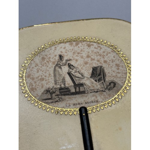 18 - A good regency fixed fan, shaped, the recto applied with gold foil and a gravure showing a mother as... 