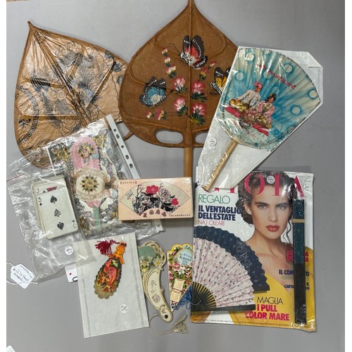 92 - A selection of fans and ephemera: a 19th century greetings card, cut paper, silvered , applied with ... 