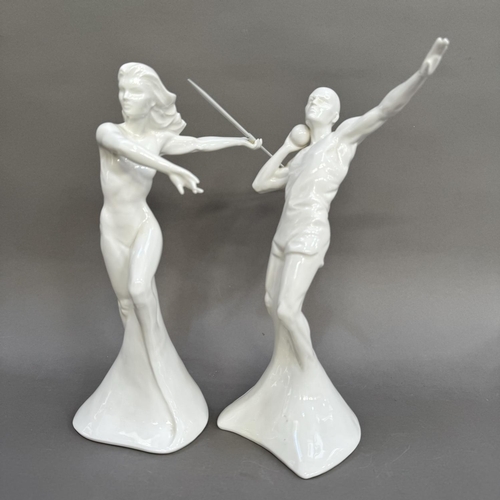 10 - A pair of Coalport white china figures from the Sporting Elements range, The Power Throw and the Win... 