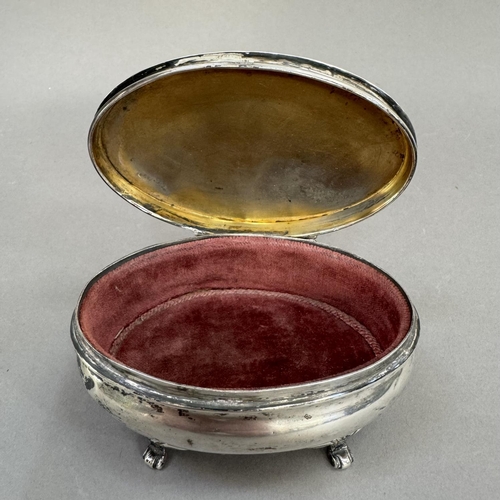 202 - An Edward VII silver dressing table box, Birmingham 1907, of oval outline, with hinged top with dimp... 