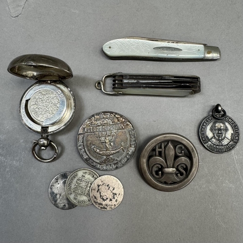 206 - A Girl Guide silver badge, c1928, pierced HGGS within a circular outline together with a British Med... 