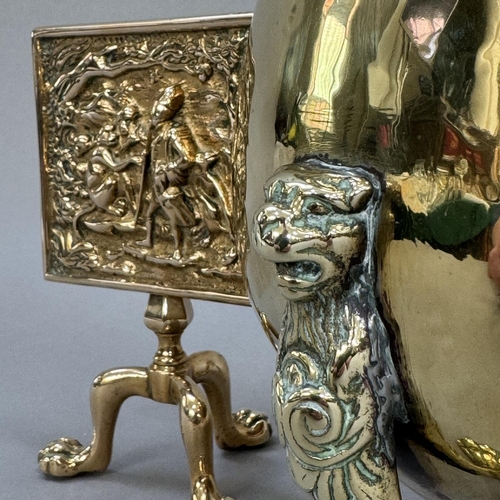 17 - A brass miniature tilt-top tripod table, the panel cast in relief with monkeys, 15.5cm high, togethe... 