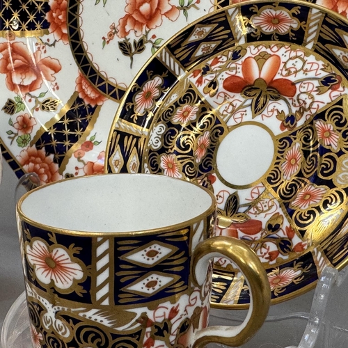 23 - A Royal Crown Derby coffee can and saucer, pattern 2451, date cipher for 1938, together with a plate... 