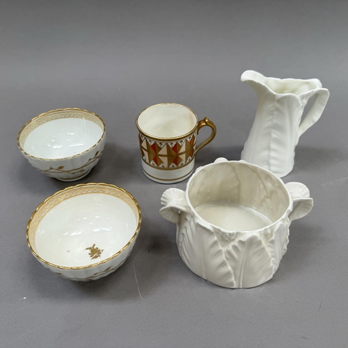 27 - A pair of 18th century china tea bowls of fluted form decorated with a trailing vine to the exterior... 