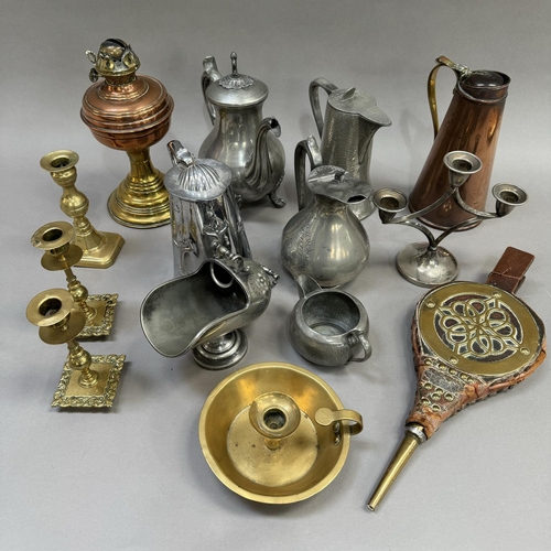 119 - A copper and brass oil lamp base, copper jug, a pair of brass candlesticks and a single candlestick,... 