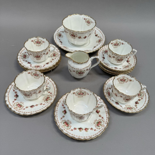 126 - An early 20th century English tea service, transfer printed and enamelled with sways and cartouche f... 