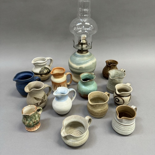 120 - A collection of studio and other pottery jugs including Moffat Pottery Scotland, ,Riverstone, Inglet... 