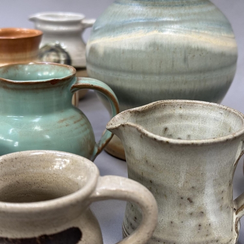 120 - A collection of studio and other pottery jugs including Moffat Pottery Scotland, ,Riverstone, Inglet... 