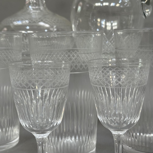 130 - A part suite of early 20th century cut and etched glass including sherry decanter and seven sherry g... 