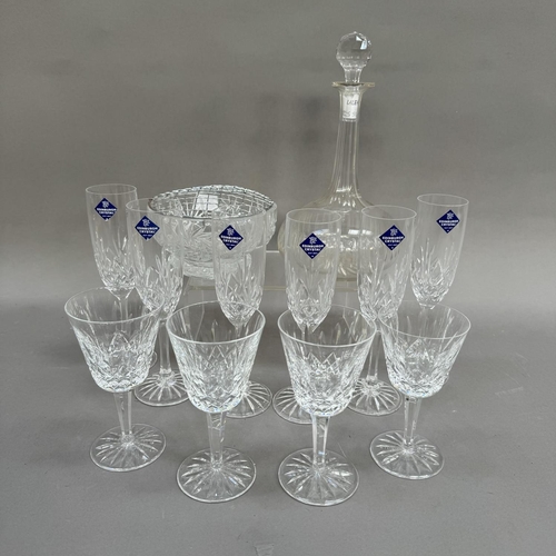 103 - A set of six Edinburgh Crystal champagne flutes together with four Waterford wines, in two sizes, a ... 