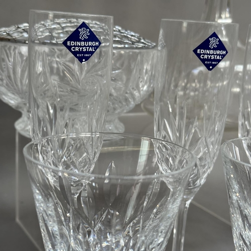 103 - A set of six Edinburgh Crystal champagne flutes together with four Waterford wines, in two sizes, a ... 