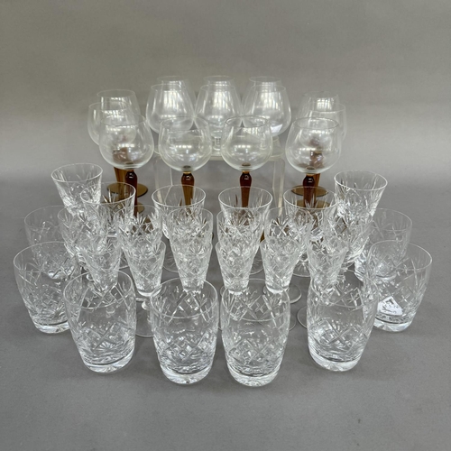 134 - Part suites of glass including ports, whiskies, brandies and a set of eight hock glasses with amber ... 