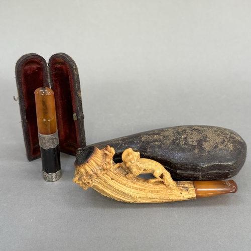 304 - A meerschaum cheroot holder in the form of a fox and chicken with amber style mouthpiece and fitted ... 