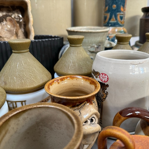 42 - Four stoneware brown dipped jars, 20cm approximately, together with a salt glazed jar, various potte... 