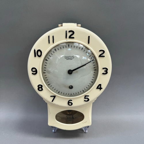 167 - A mid 20th century Smiths Bakelite pendulum wall clock with key