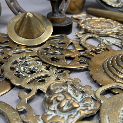 145 - A quantity of Victorian and later horse brasses together with a jewellery ring size gauge and a bras... 