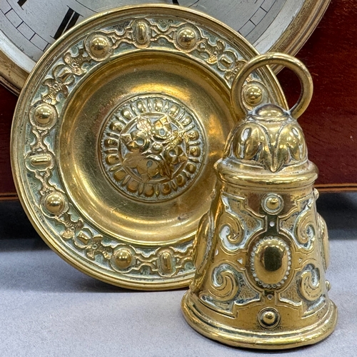 8 - An Edwardian mahogany mantel clock inlaid with box wood and ebony stringing, arched profile on brass... 