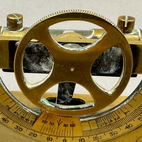 31 - An early 20th century brass clinometer by J H Stuart, 406 Strand, London, 12cm