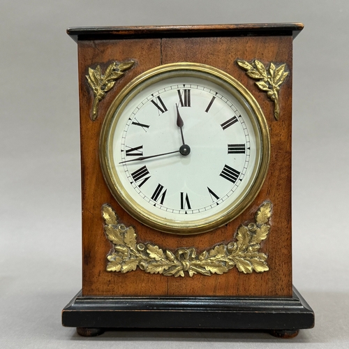 4 - A late 19th century walnut ebonised and gilt metal bracket clock having a white enamel dial and blac... 