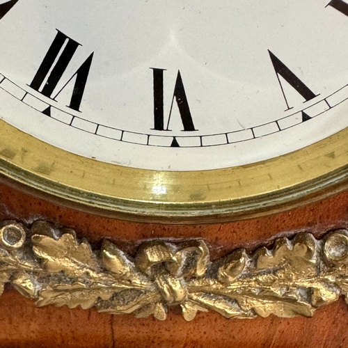 4 - A late 19th century walnut ebonised and gilt metal bracket clock having a white enamel dial and blac... 