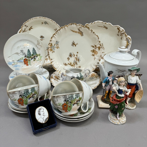 100 - A French china part dessert service comprising two oval serving dishes, two circular ones and two pl... 