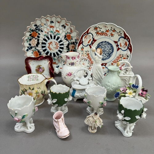 113 - Two Imari plates, four continental flower encrusted egg cups on chicken feet, two trinket boxes mode... 