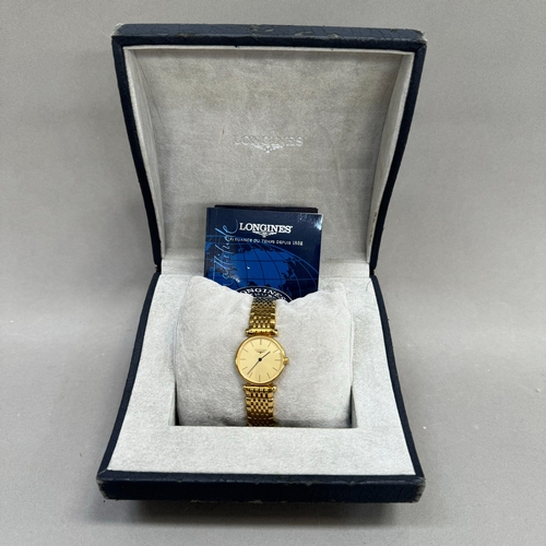 221 - A Longines lady's quartz wristwatch in gilt case no 31490544, matt gilt dial with black batons and h... 