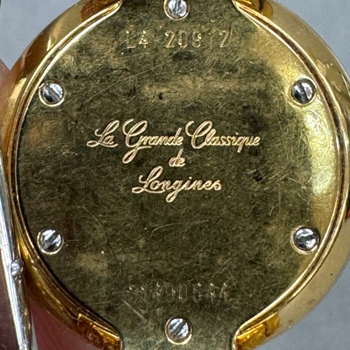 221 - A Longines lady's quartz wristwatch in gilt case no 31490544, matt gilt dial with black batons and h... 