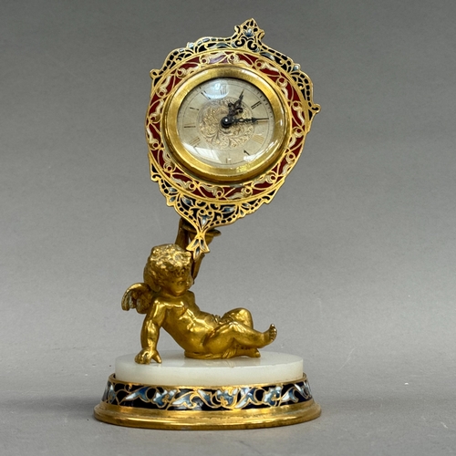 34 - A Swiss champlevé enamel and gilt metal mantel clock, the silvered dial with black Roman numerals, l... 