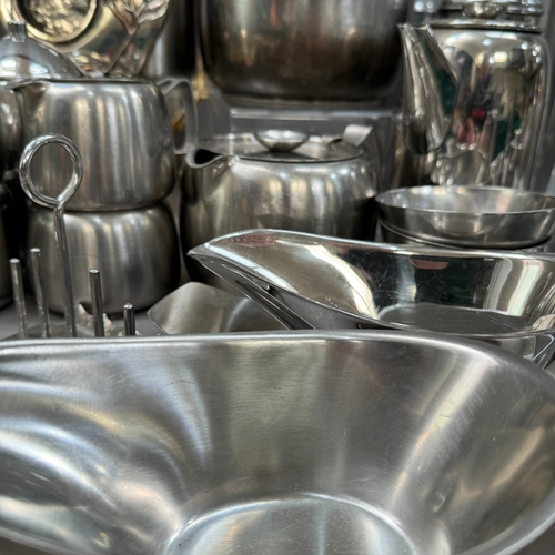 154 - A large collection of stainless steel ware, teapot, hot water jug, coffee pot, storage jar, toast ra... 