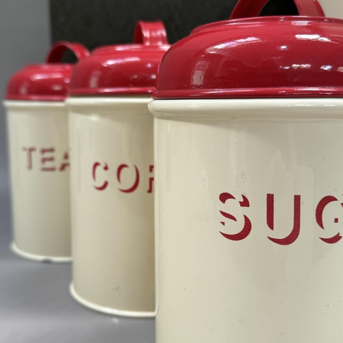 181 - A document box, an enamelled breadbin, three enamel storage cannisters with red enamel lids