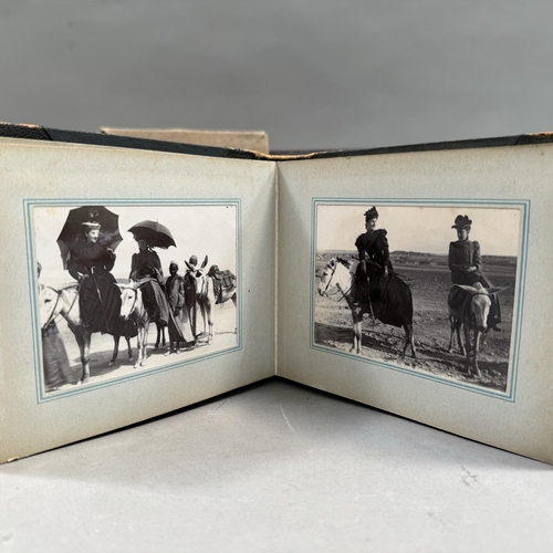 306 - A Victorian photograph album of tourists visiting Egypt showing the group on a Nile cruise ship, rid... 