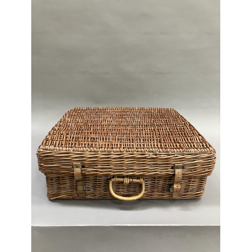 249 - A vintage wicker picnic hamper by Sirram, circa 1950/60s fitted with six knives, forks and teaspoons... 