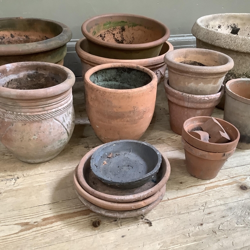 54 - A collection of terracotta plant pots measuring from 27.5cm high to 10cm together with a stone mix p... 