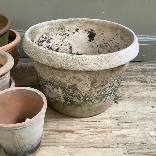 54 - A collection of terracotta plant pots measuring from 27.5cm high to 10cm together with a stone mix p... 