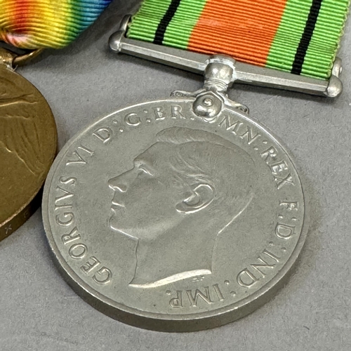 313 - First World War and Victory medals named to PTE E H St John Middlesex Regt plus Second World War def... 